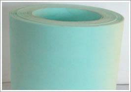 A roll of green air filter paper